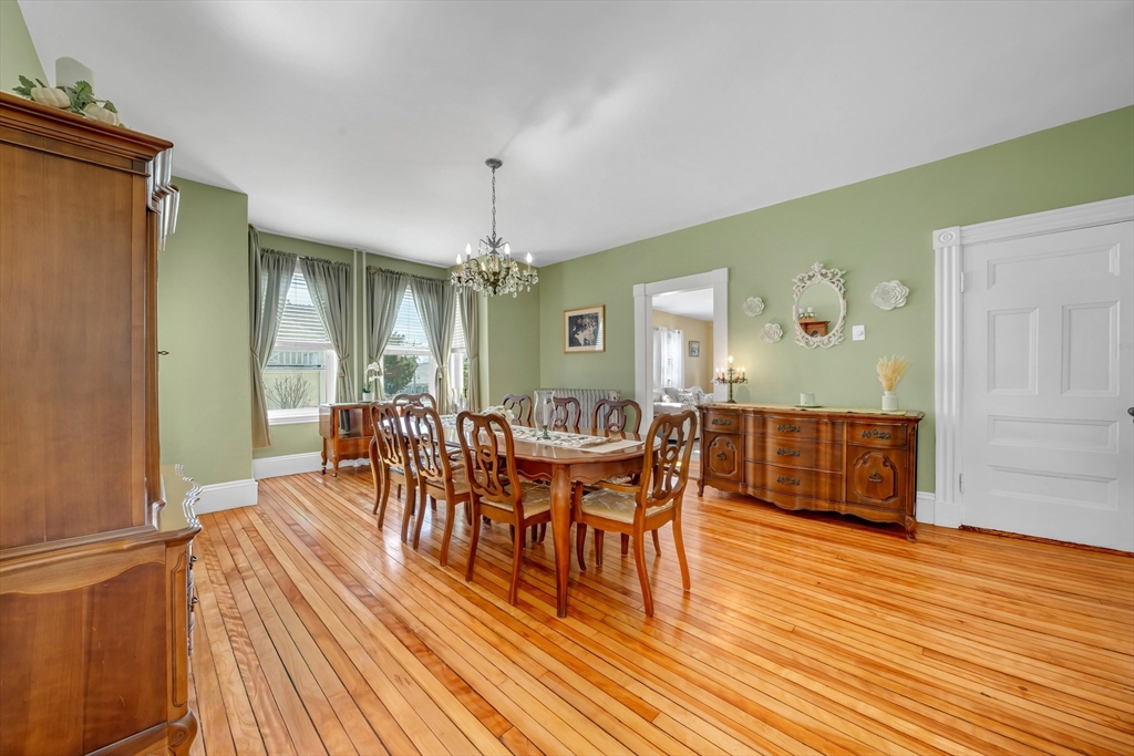 59 Washington Street Ipswich, MA 01938 - Photo 17 of 42 a view of a dining room with furniture and wooden floor