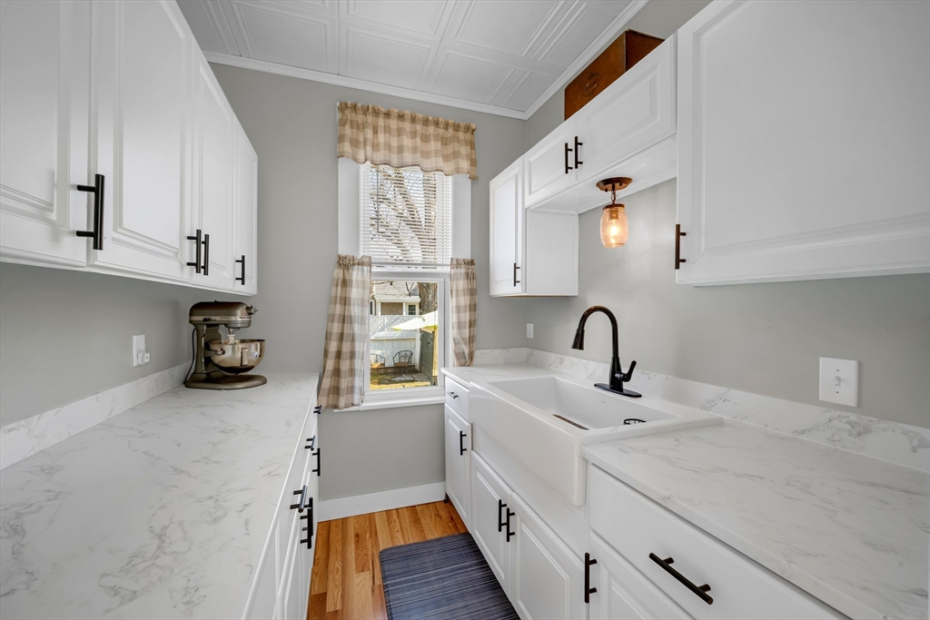 59 Washington Street Ipswich, MA 01938 - Photo 20 of 42 a kitchen with a sink cabinets and appliances