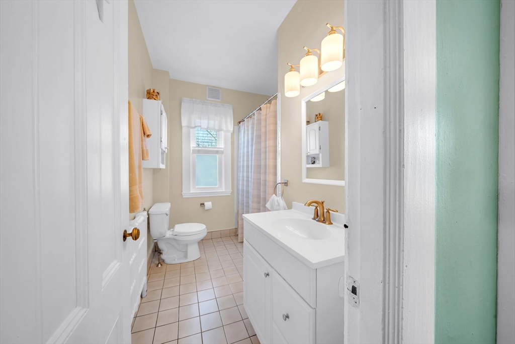 59 Washington Street Ipswich, MA 01938 - Photo 31 of 42 a bathroom with a sink toilet and shower