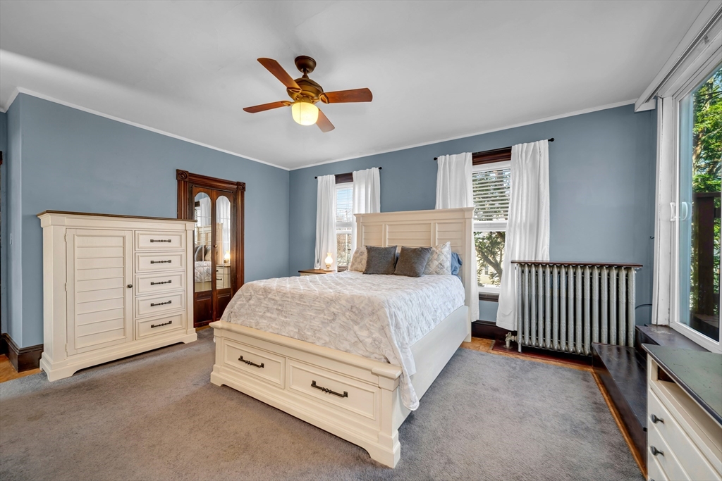 59 Washington Street Ipswich, MA 01938 - Photo 33 of 42 a spacious bedroom with a bed a window and closet