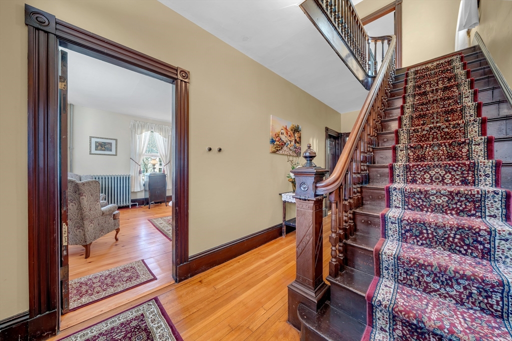 59 Washington Street Ipswich, MA 01938 - Photo 8 of 42 a view of an entryway with wooden floor and a livingroom view