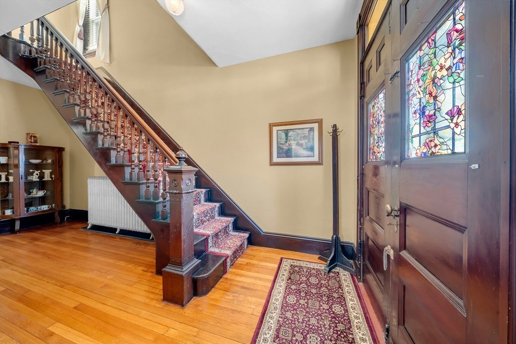 59 Washington Street Ipswich, MA 01938 - Photo 9 of 42 a view of staircase with wooden floor and a rug