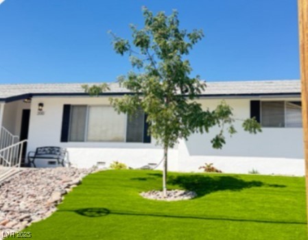 Undisclosed Address Boulder City, NV 89005 - Photo 1 of 19 View of front facade featuring a front yard