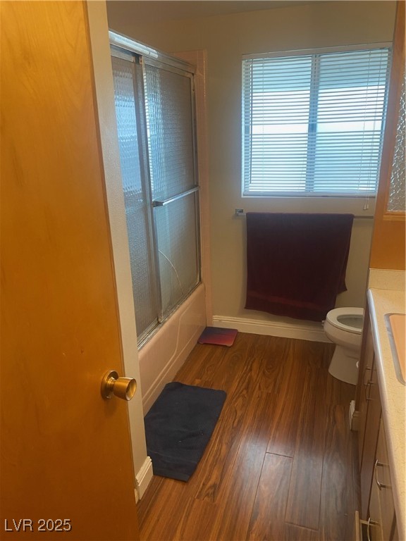 Undisclosed Address Boulder City, NV 89005 - Photo 16 of 19 Bathroom with vanity, wood finished floors, toilet