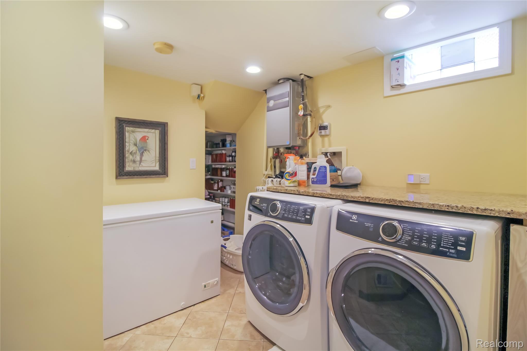 5953 Cooper Street Taylor, MI 48180 - Photo 22 of 33 Utility area featuring tiled flooring, recessed lighting, and a granite-finish countertop