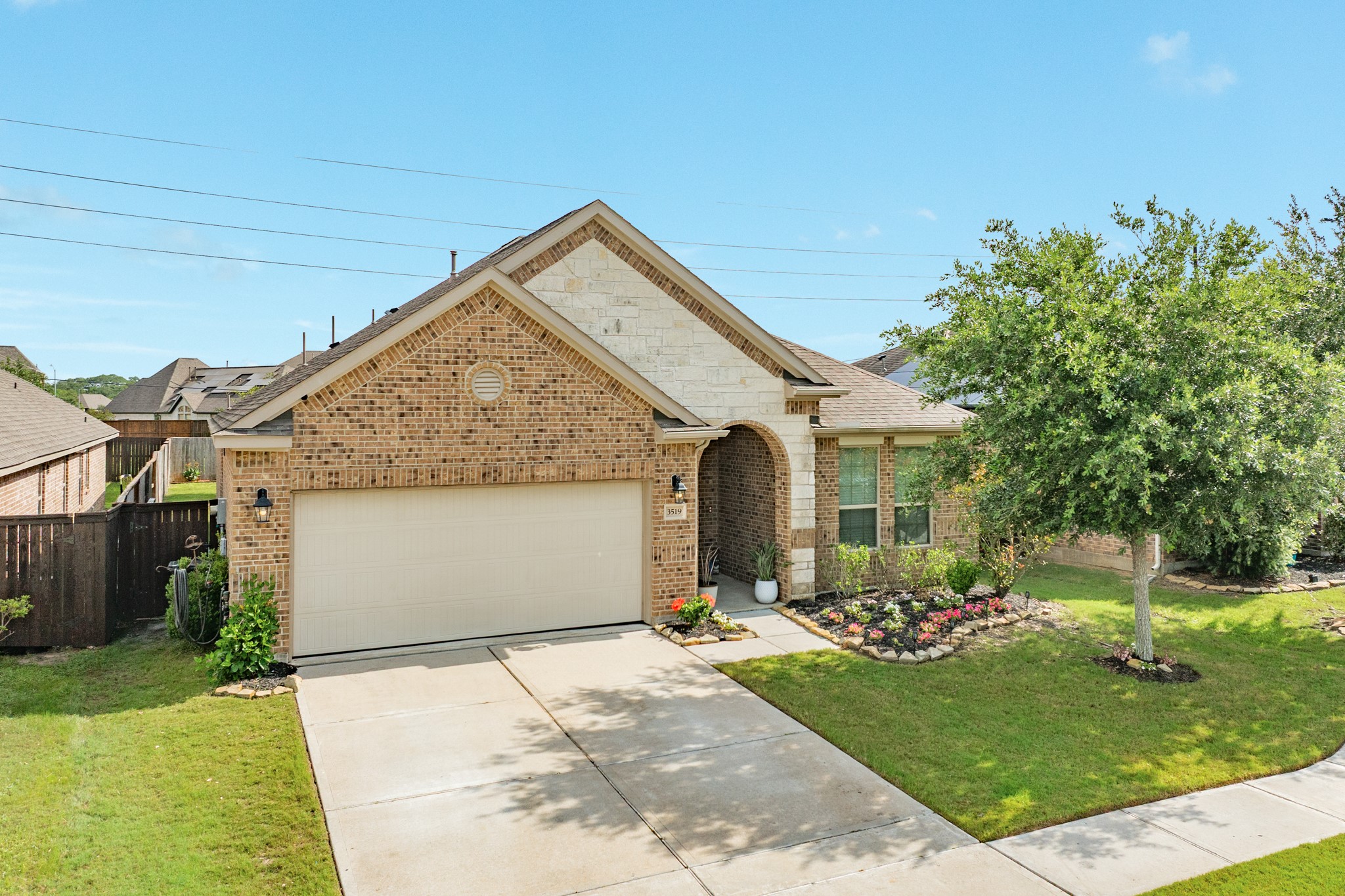 3519 Bay Drive Rosharon, TX 77583 - Photo 23 of 49 Aerial view showcasing the front of this beautiful new home, featuring an elegant brick and stone exterior.