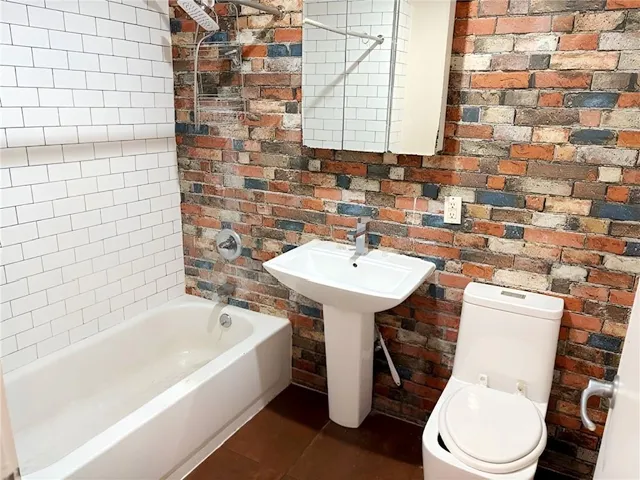 a bathroom with a sink and toilet
