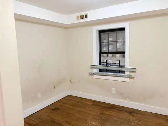 a view of a kitchen with wooden floor