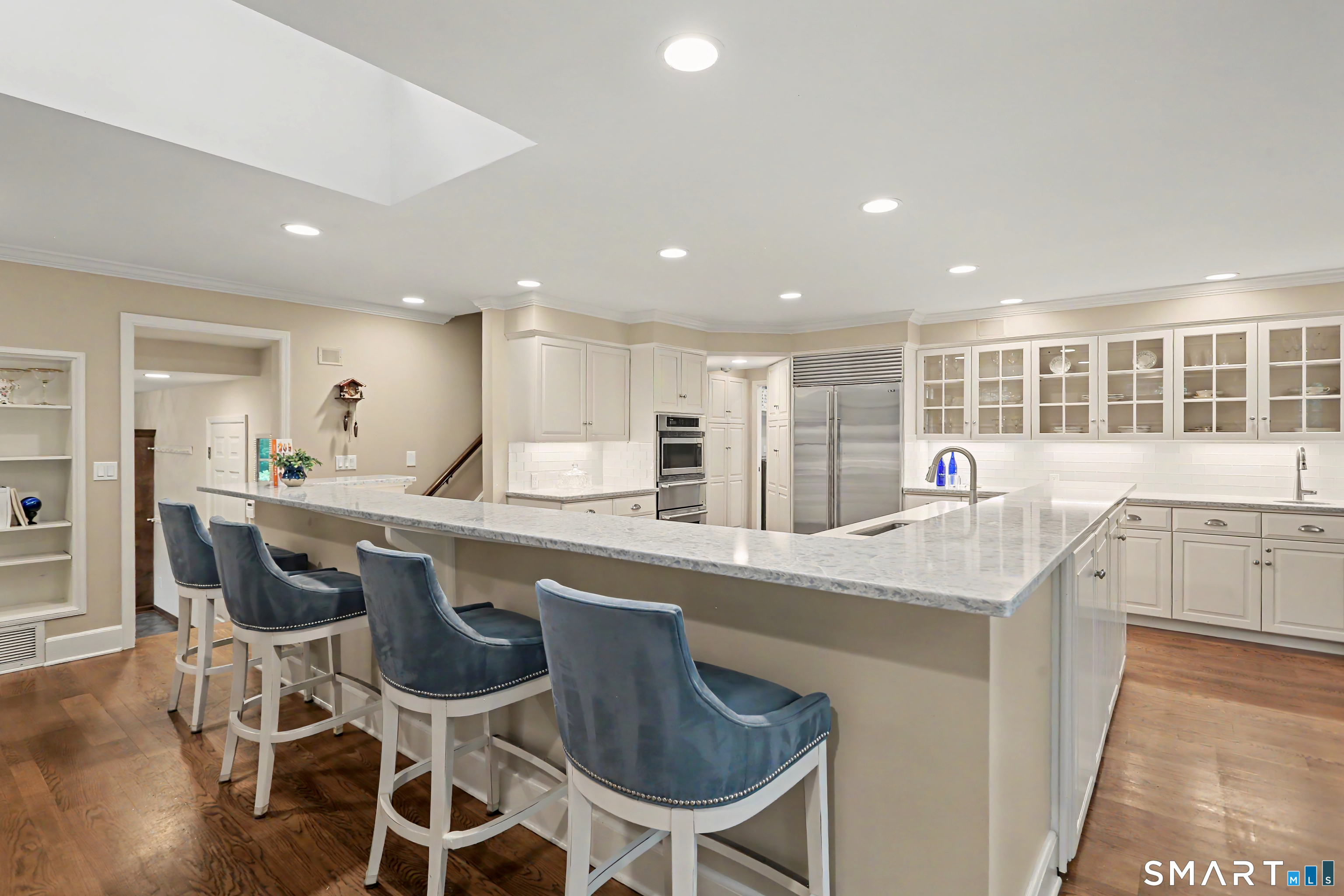 108 Logan Road New Canaan, CT 06840 - Photo 8 of 40 a kitchen with a table and chairs in it