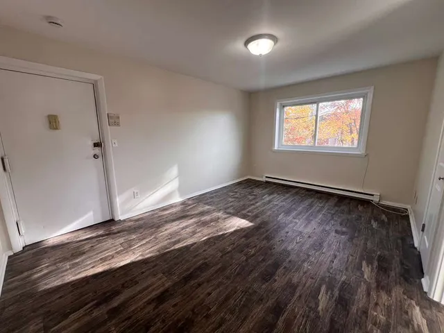 a view of an empty room and window