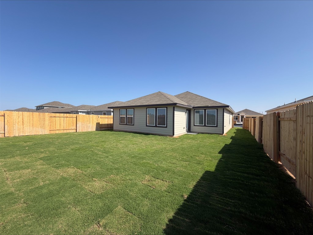 113 Honey Bee Road Jarrell, TX 76537 - Photo 6 of 10 Back of house with a fenced backyard