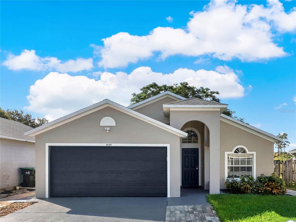 9420 Azalea Ridge Way Gotha, FL 34734 - Photo 1 of 1 a front view of a house with a yard
