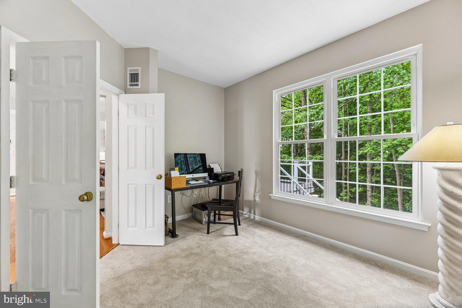 3707 Turn Back Trail Triangle, VA 22172 - Photo 19 of 55 a view of a workspace with furniture and a window
