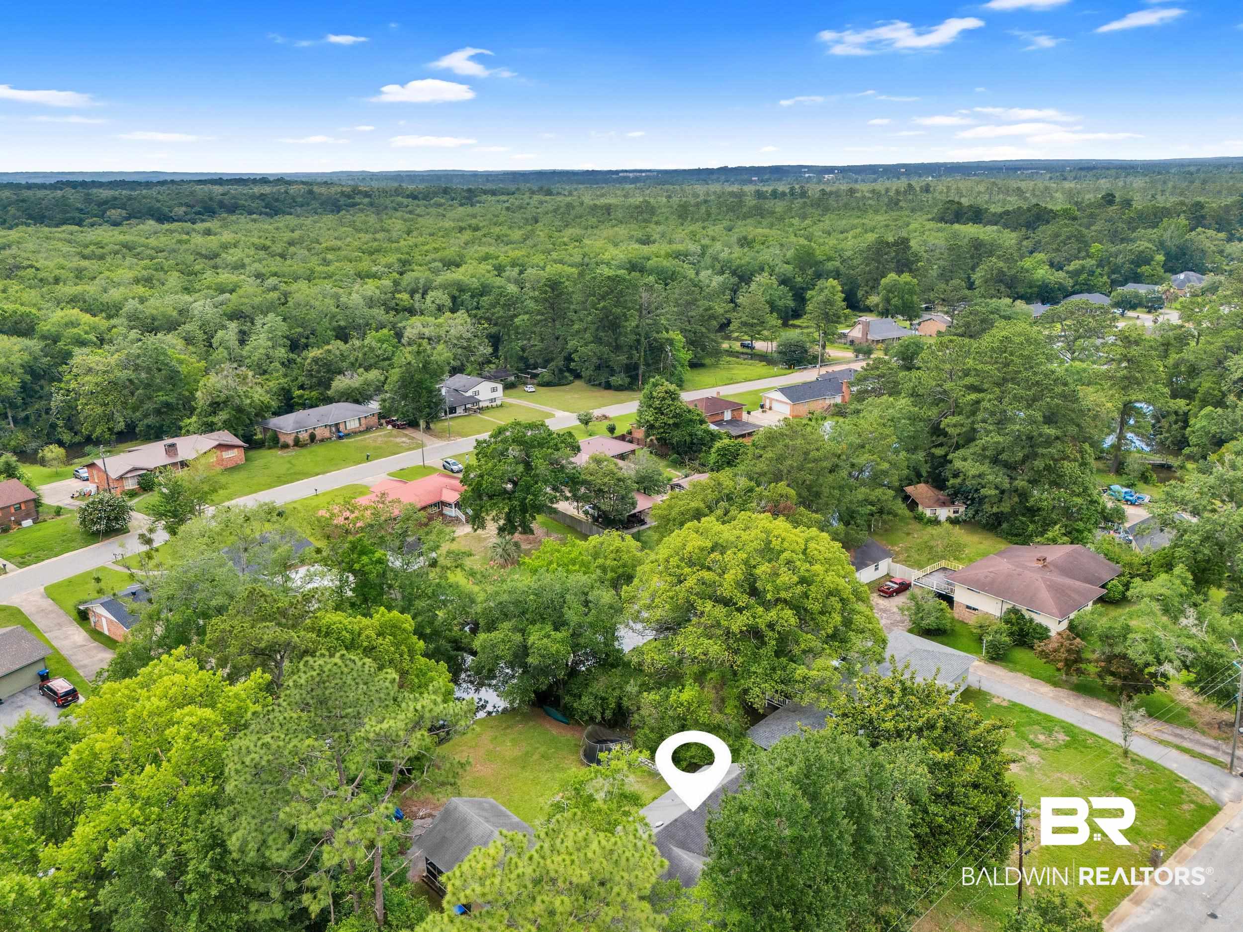 224 Cache Circle Mobile, AL 36611 - Photo 29 of 42 Aerial view of residential area featuring a forest