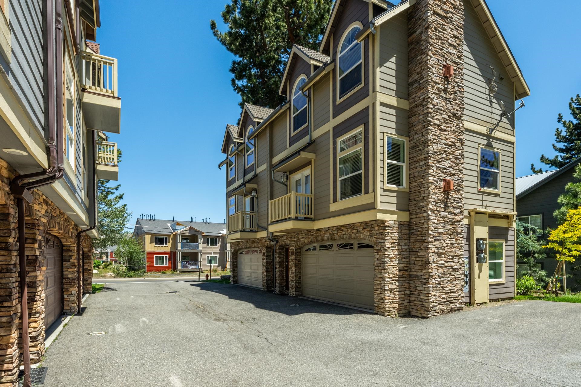 1787 Old Mammoth Road, Unit 2 Mammoth Lakes, CA 93546 - Photo 26 of 29 Multi-story townhome with stacked stone accents and horizontal siding