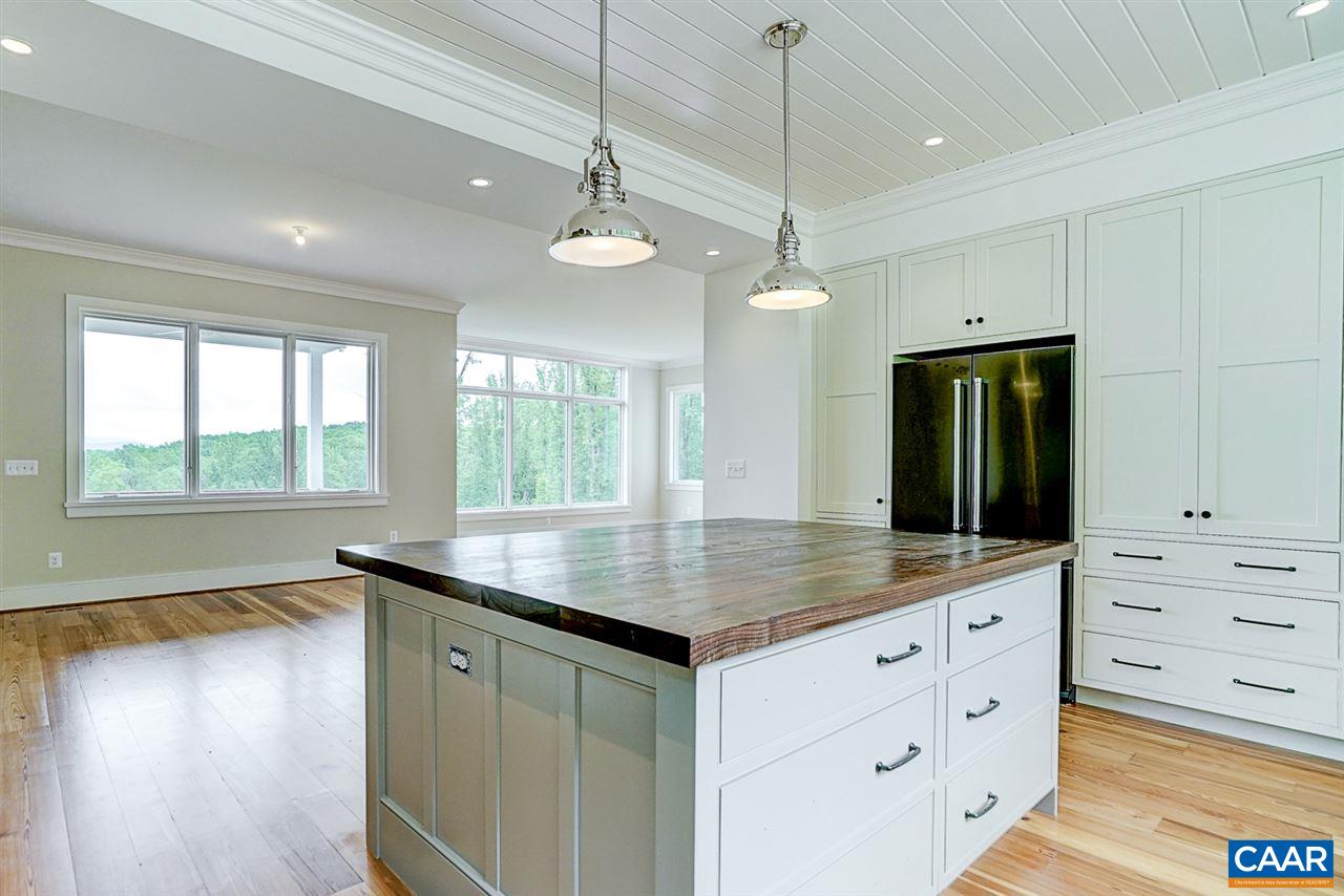 901 Tilman Road Charlottesville, VA 22901 - Photo 11 of 49 a kitchen with a sink a large window and stainless steel appliances