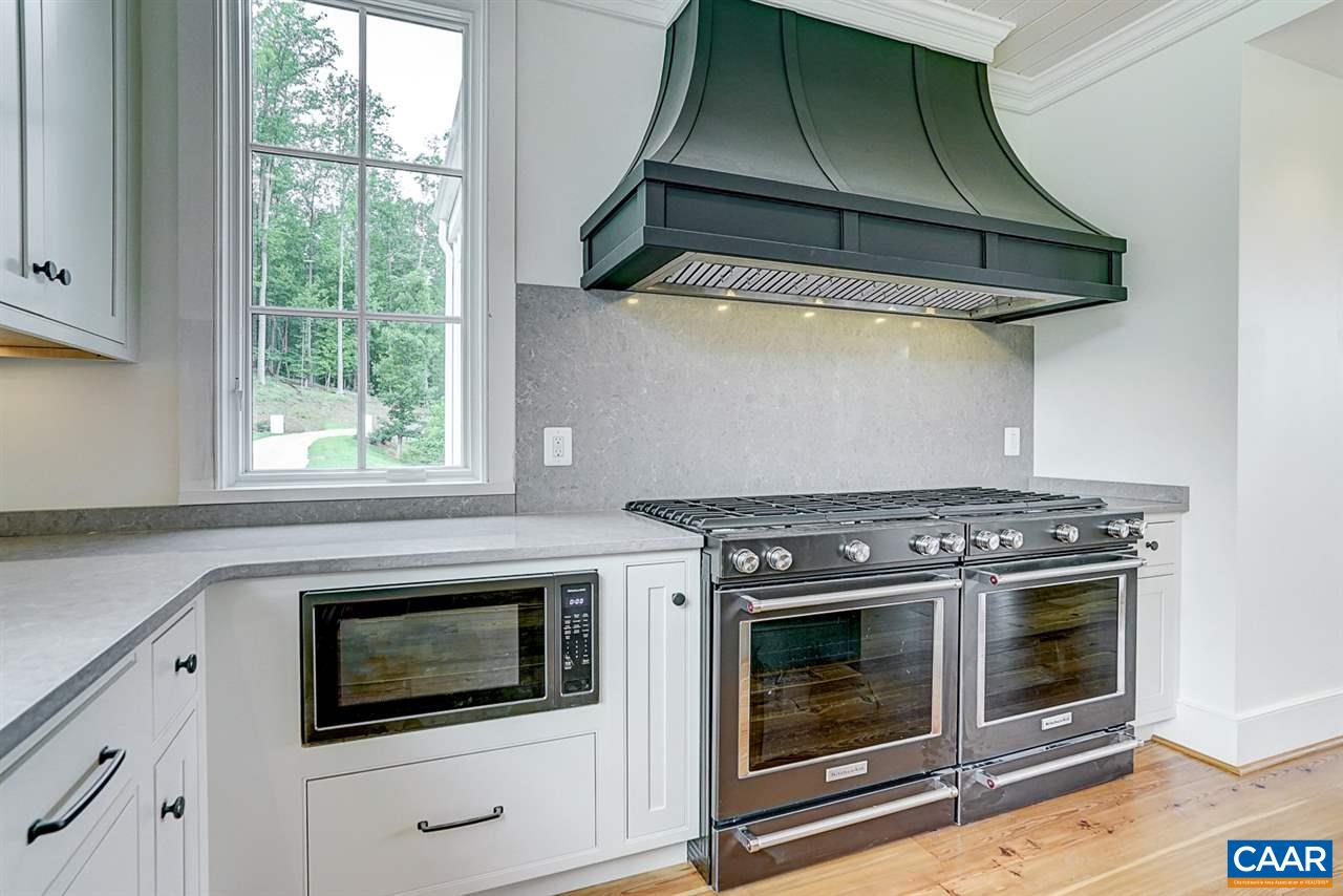 901 Tilman Road Charlottesville, VA 22901 - Photo 18 of 49 a stove top oven sitting inside of a kitchen