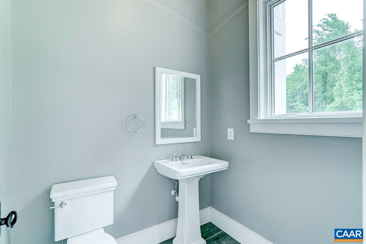 901 Tilman Road Charlottesville, VA 22901 - Photo 26 of 49 a bathroom with a sink a mirror and a toilet
