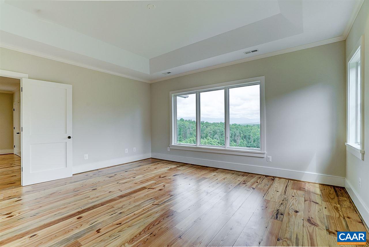 901 Tilman Road Charlottesville, VA 22901 - Photo 32 of 49 an empty room with wooden floor and windows