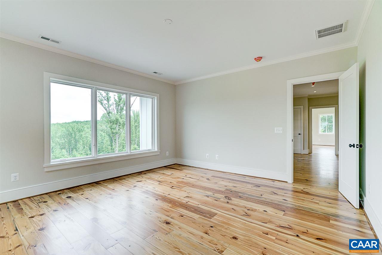 901 Tilman Road Charlottesville, VA 22901 - Photo 35 of 49 a view of an empty room with wooden floor and a window