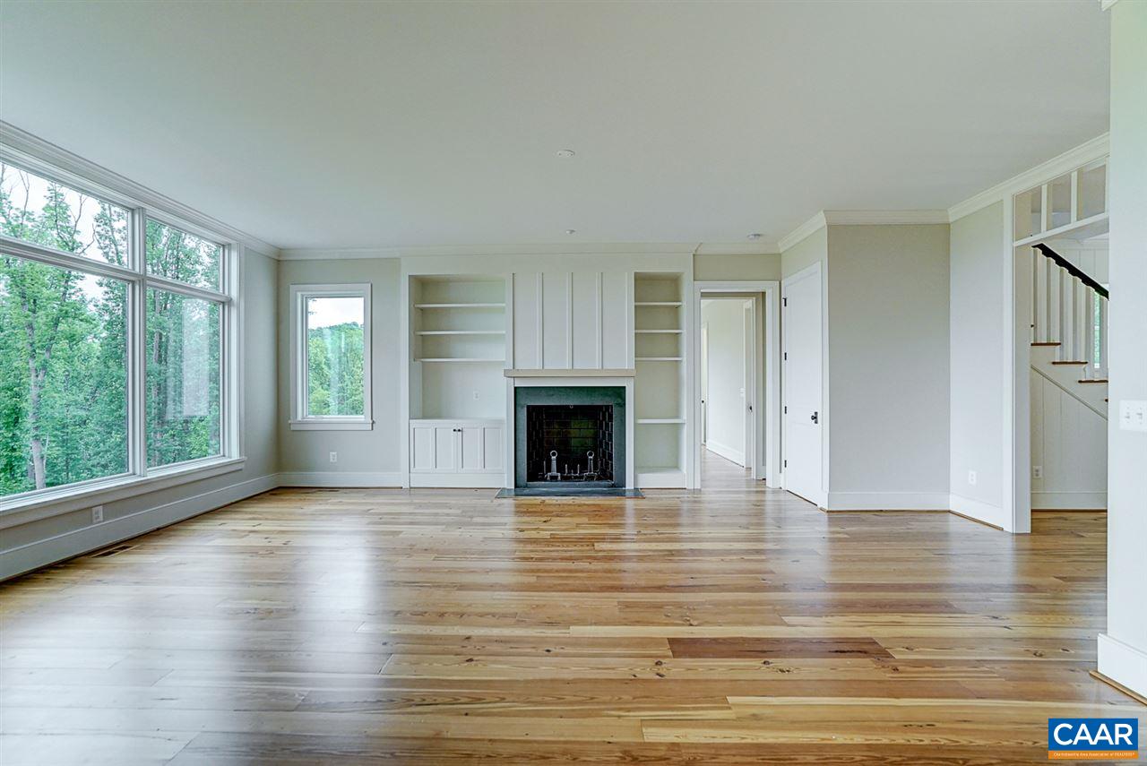 901 Tilman Road Charlottesville, VA 22901 - Photo 7 of 49 a view of a livingroom with wooden floor and a fireplace