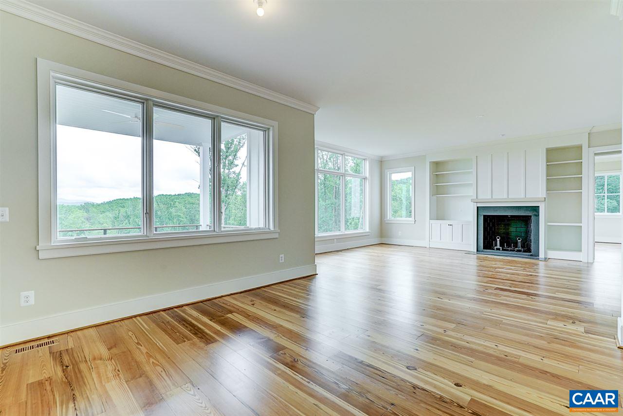 901 Tilman Road Charlottesville, VA 22901 - Photo 8 of 49 a view of an empty room with wooden floor and a window