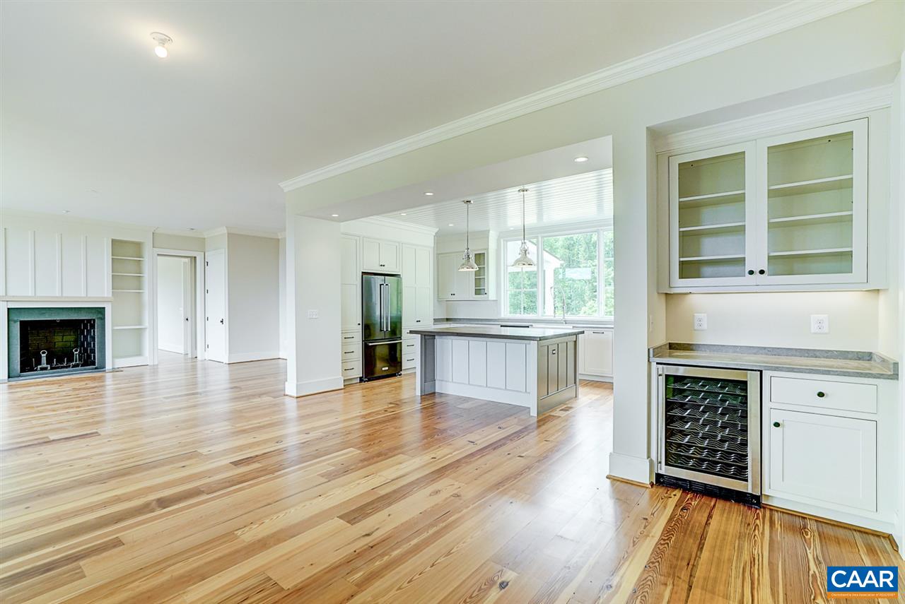 901 Tilman Road Charlottesville, VA 22901 - Photo 10 of 49 a view of an empty room with wooden floor and a window