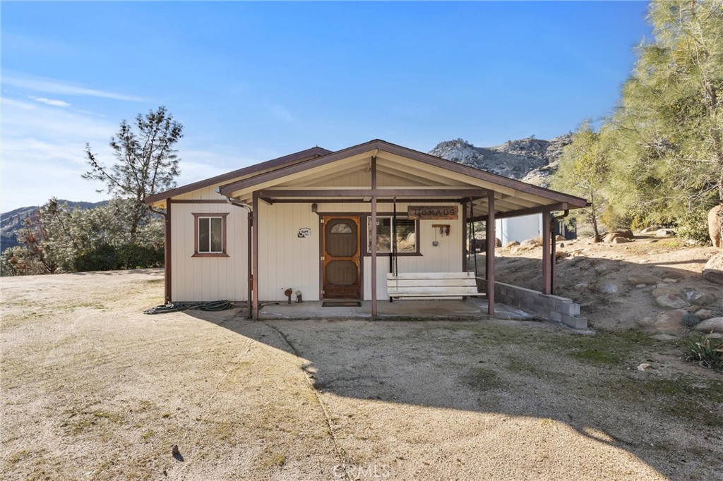9990 Fay Ranch Road Weldon, CA 93283 - Photo 14 of 51 a front view of a house with a yard