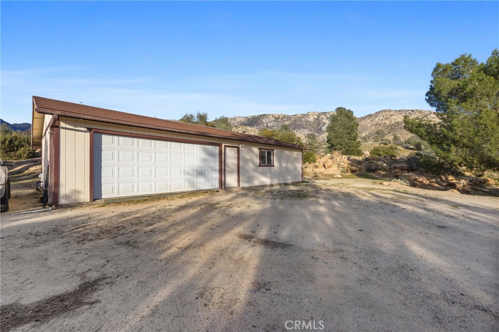 9990 Fay Ranch Road Weldon, CA 93283 - Photo 16 of 51 a view of large house with a road
