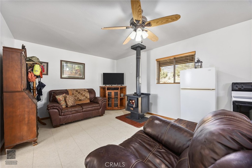 9990 Fay Ranch Road Weldon, CA 93283 - Photo 36 of 51 a living room with furniture and a flat screen tv