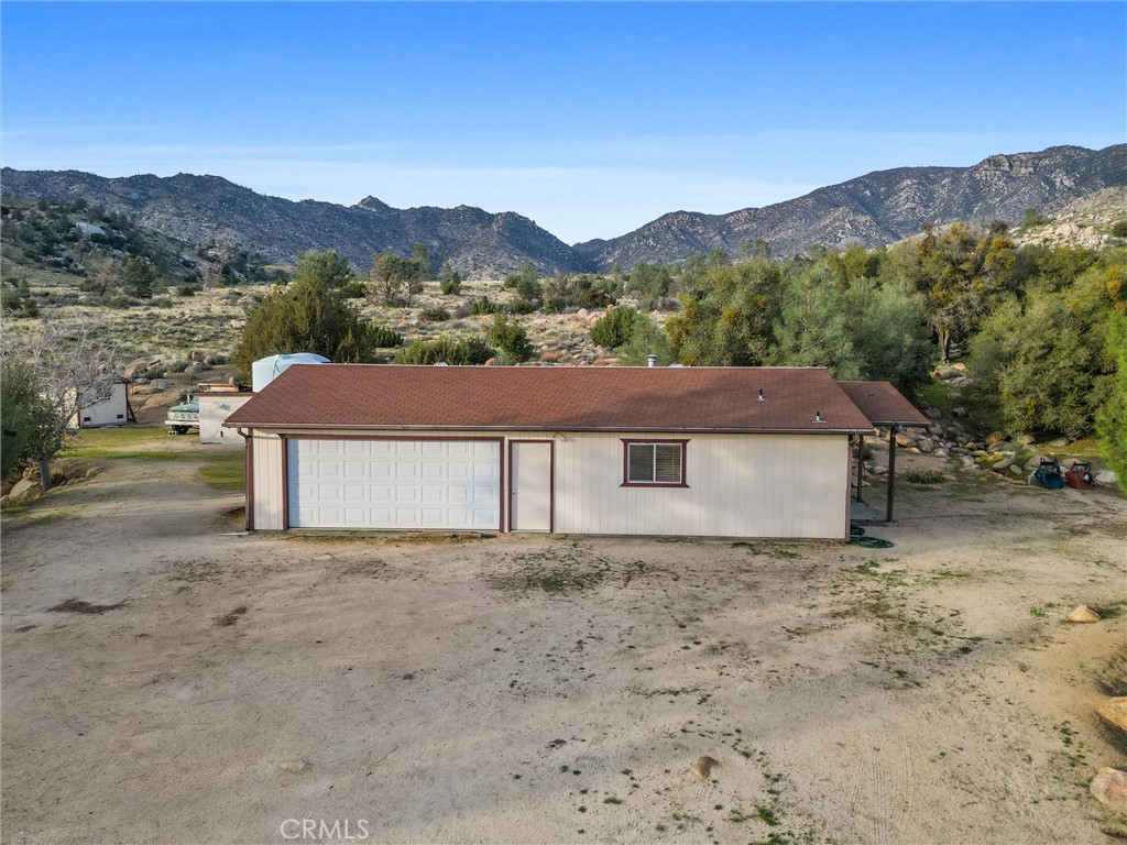 9990 Fay Ranch Road Weldon, CA 93283 - Photo 4 of 51 a front view of a house with a yard