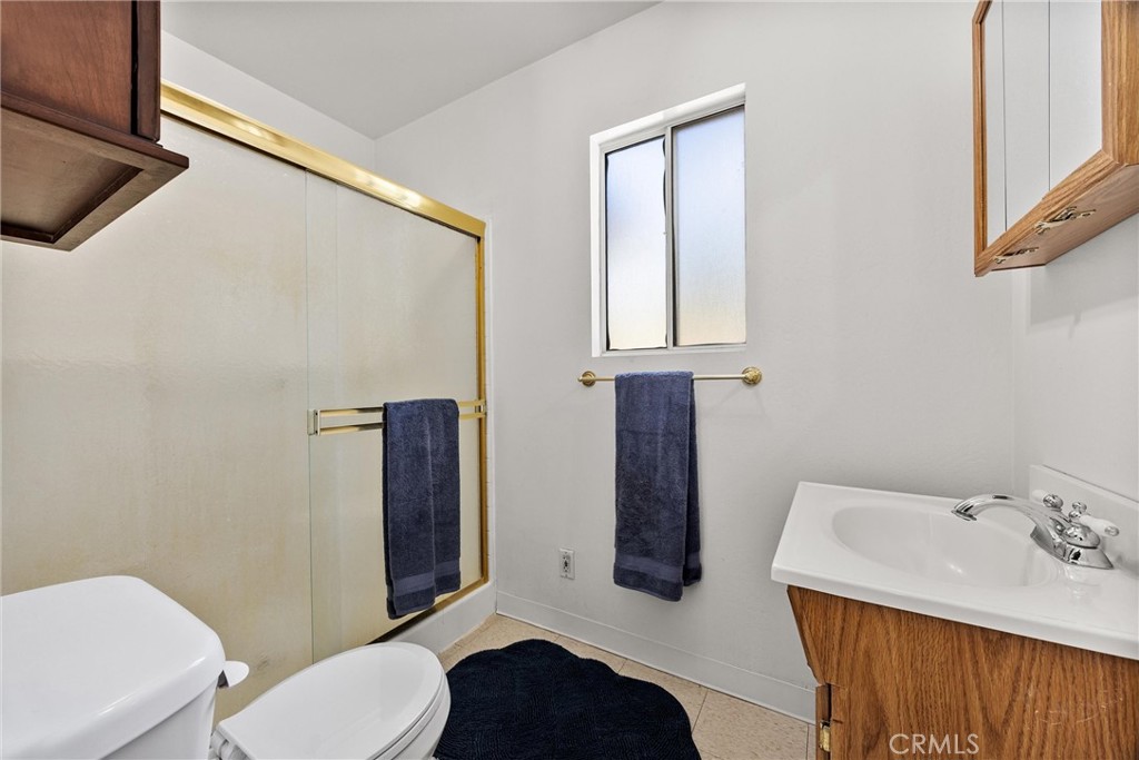 9990 Fay Ranch Road Weldon, CA 93283 - Photo 45 of 51 a bathroom with a sink a toilet and mirror