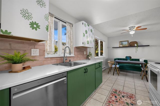 a kitchen with a sink and cabinets