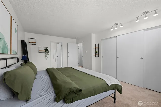 a bedroom with a bed and a couch