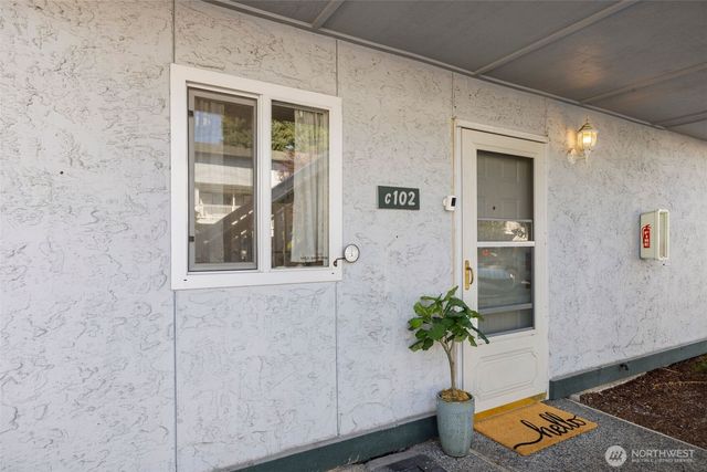 a potted plant sitting in front of a door