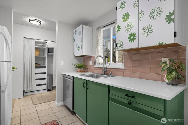 a kitchen with a sink and cabinets