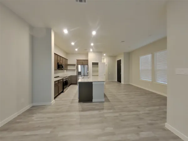 a view of kitchen with wooden floor