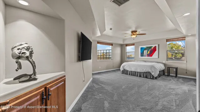a living room with a bed furniture and a window