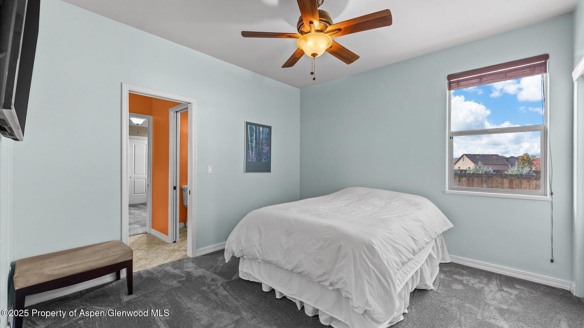 1984 J Road Fruita, CO 81521 - Photo 23 of 40 a bedroom with a bed and a window