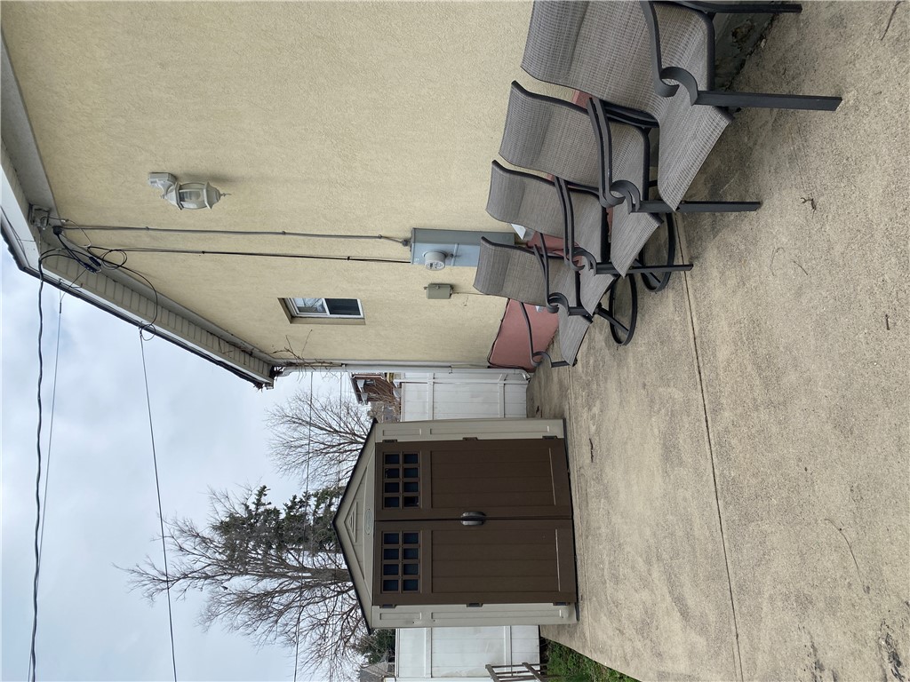 175 Rita Street Dayton, OH 45404 - Photo 47 of 48 This private outdoor space offers a durable shed and concrete patio for functional living.