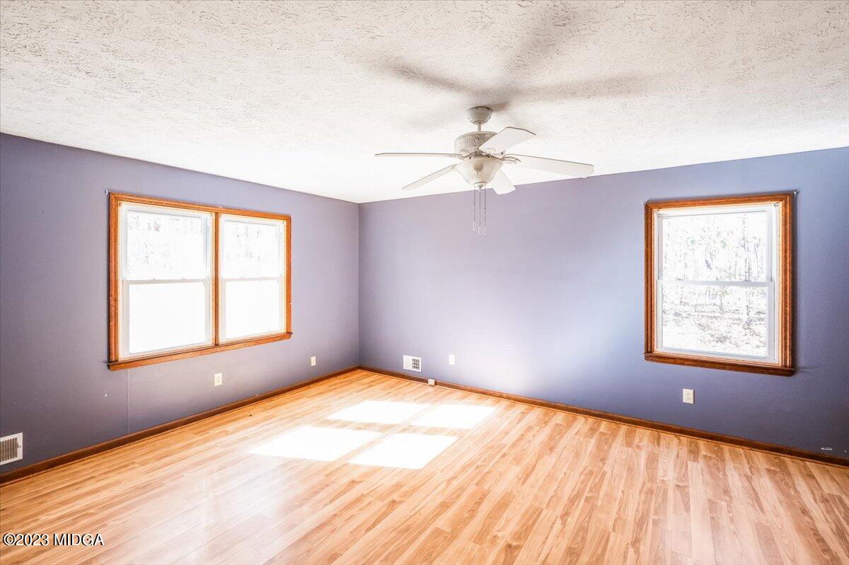 546 Old Union Gin Road Forsyth, GA 31029 - Photo 12 of 23 a view of an empty room with a window