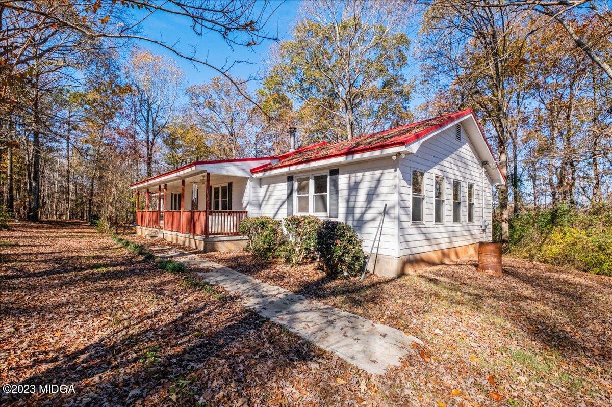 546 Old Union Gin Road Forsyth, GA 31029 - Photo 14 of 23 a front view of a house with a yard