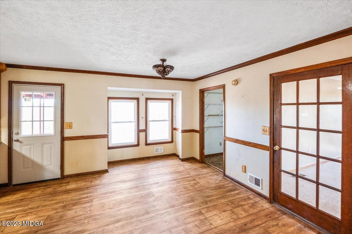 546 Old Union Gin Road Forsyth, GA 31029 - Photo 6 of 23 a view of an empty room with a window