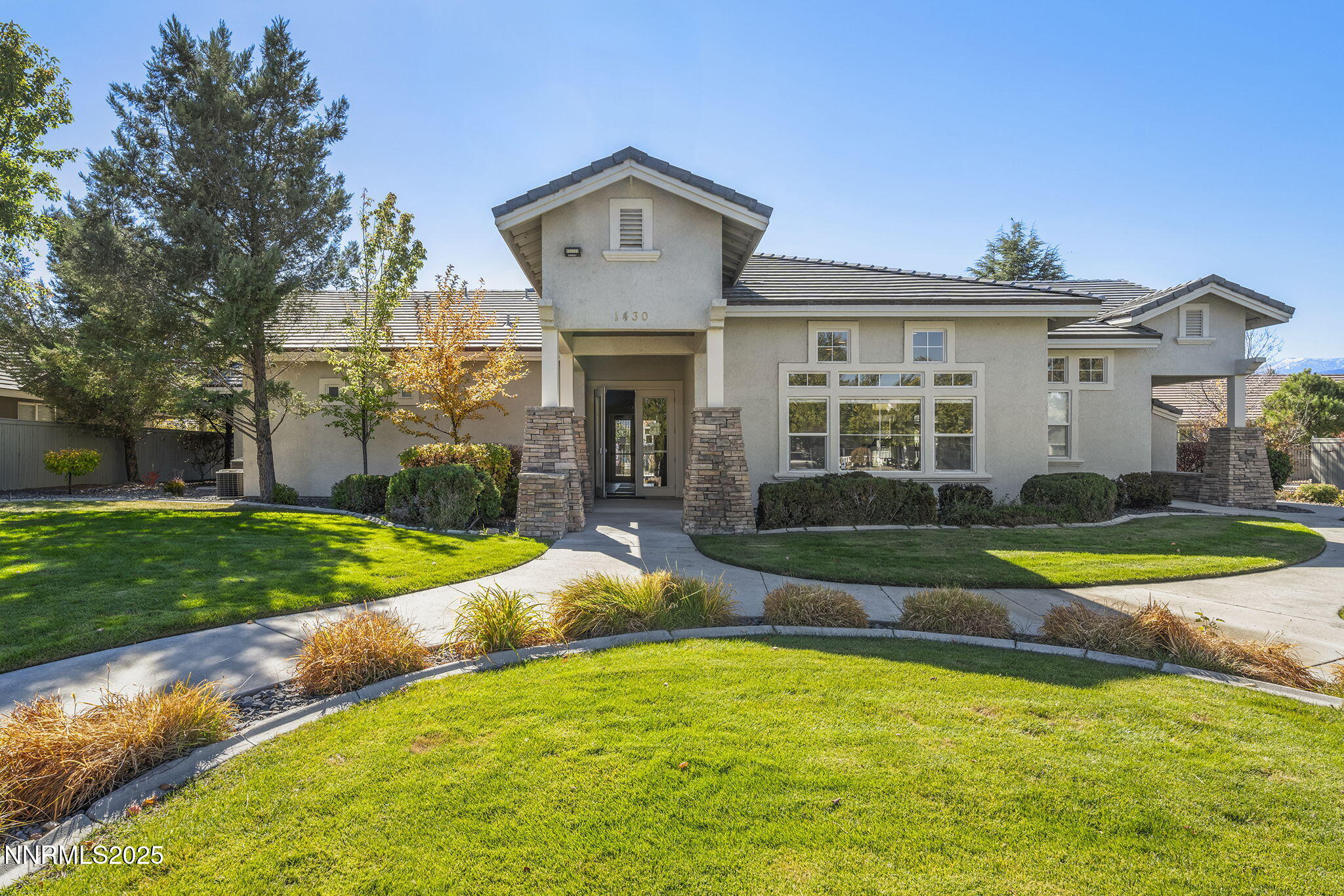 10145 Donner Peak Drive Reno, NV 89521 - Photo 26 of 32 a view of a house with a big yard and large trees