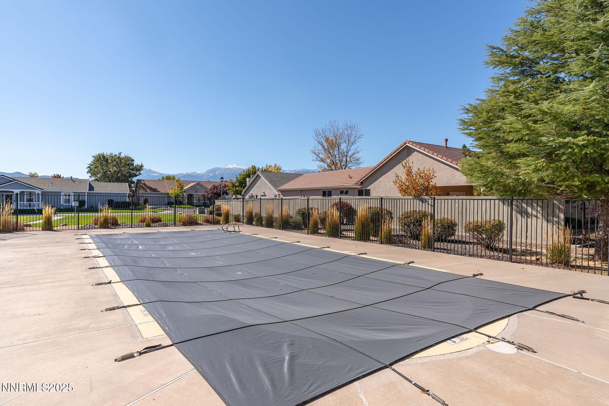 10145 Donner Peak Drive Reno, NV 89521 - Photo 29 of 32 a front view of a house with a garden
