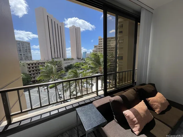 a view of a balcony with chairs