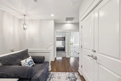a bedroom with a bed and a flat tv screen