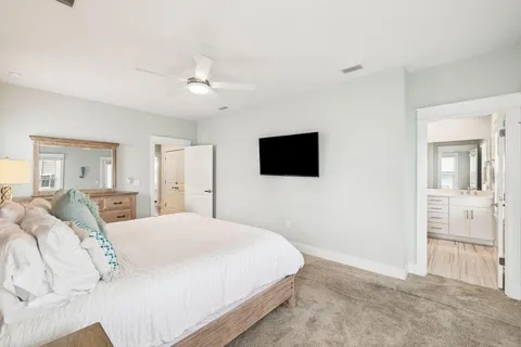 a bathroom with a granite countertop sink toilet a tub and shower
