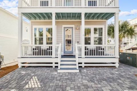 a view of a porch with wooden floor and fence