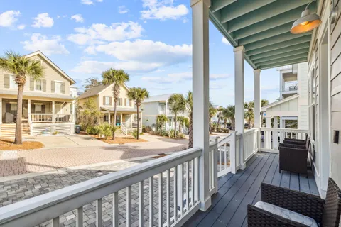 a view of a swimming pool with potted plants